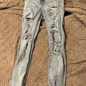 Light Blue Distressed Skinny Jeans with Rips and Tapered Leg
